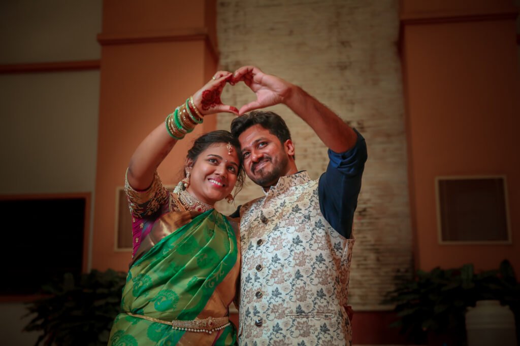 Photo of the couple posing and holding each other's fingers and showing  rings during the typical Indian engagement ceremony. Stock Photo | Adobe  Stock